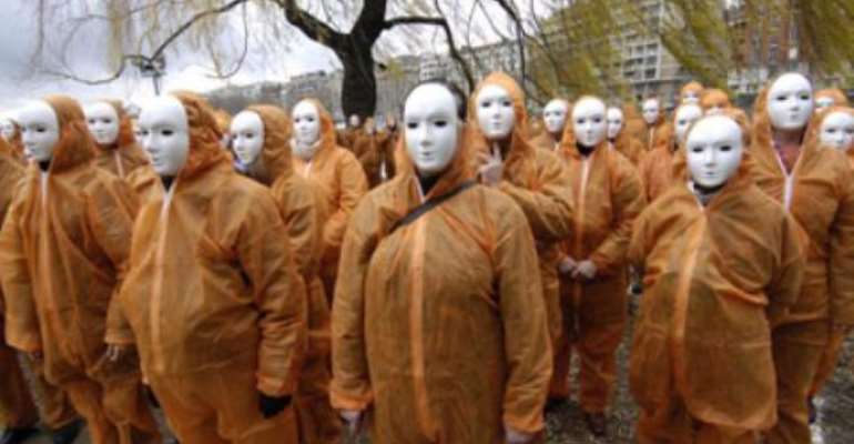 Stephane de Sakutin/Getty Images
Amnesty International members protest reported abuses of detainees at the hands of U.S. military at Guantanamo Bay, Cuba, in Paris in January 2007.